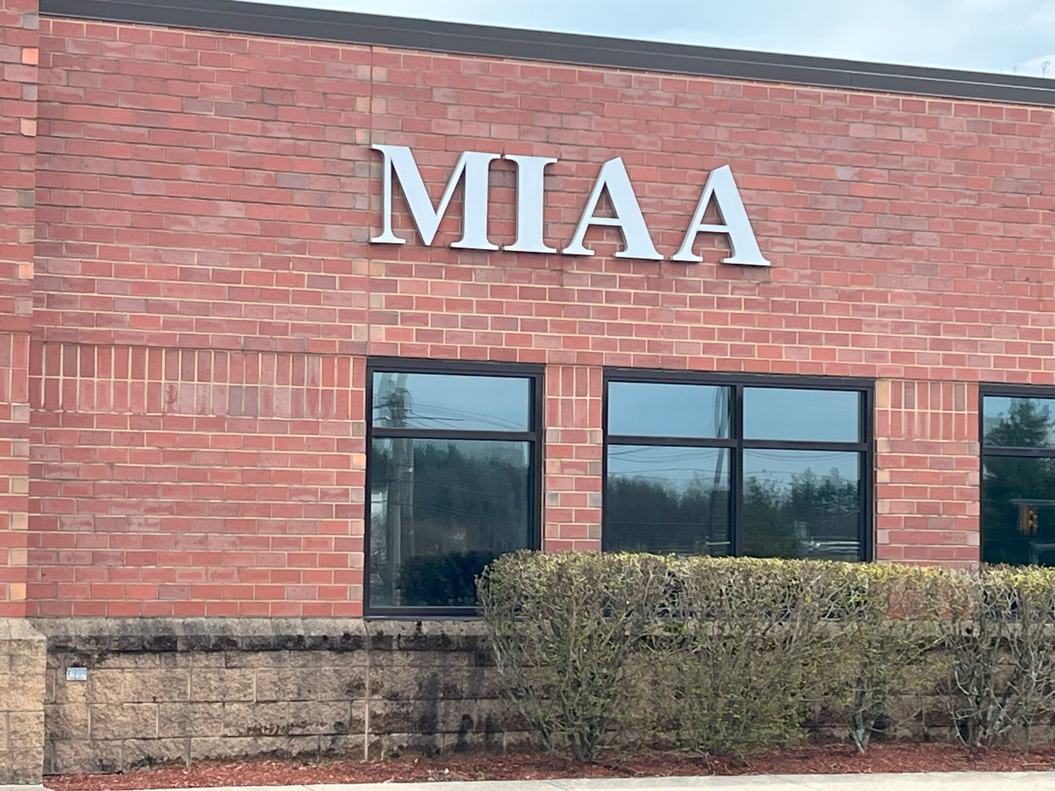 Exterior of a brick building with the lettering MIAA