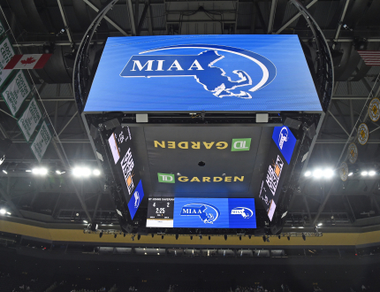 a large-scale video board called a jumbotron in an arena sitting high above the center court