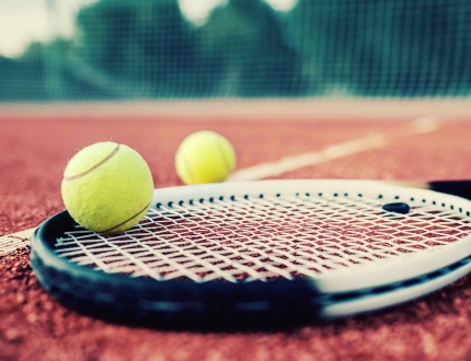 tennis equipment sitting on a court