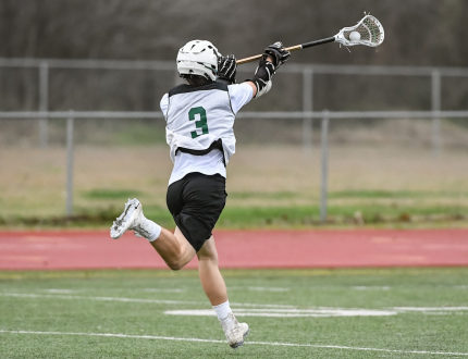 A person playing lacrosse
