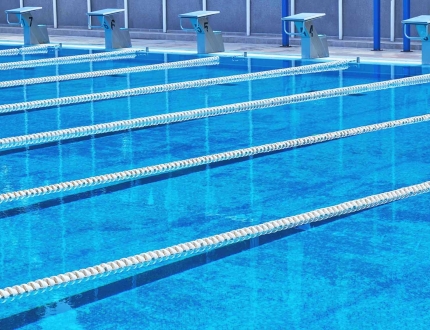 an empty swimming pool with lanes