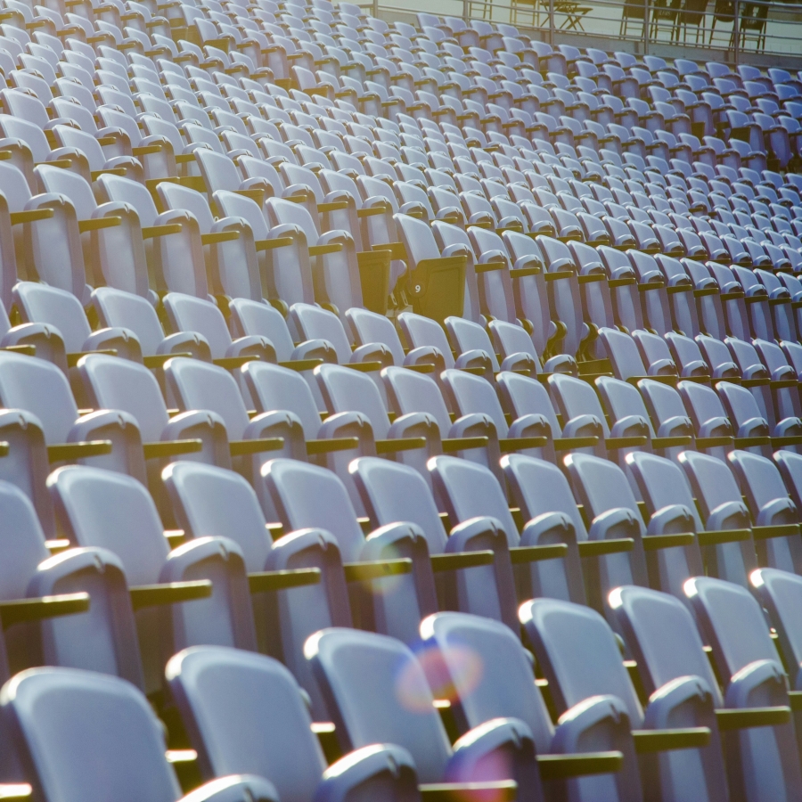 bleacher seats in a row with sunbeams shining down